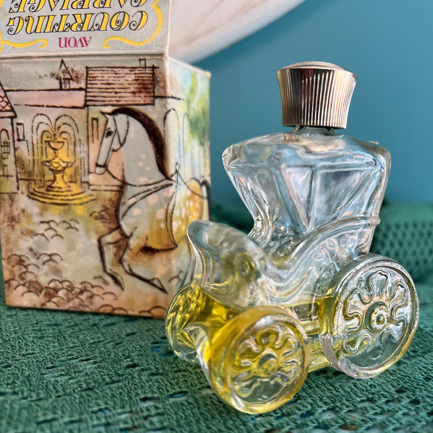 Avon Courting Carriage Moonwind cologne bottle display
