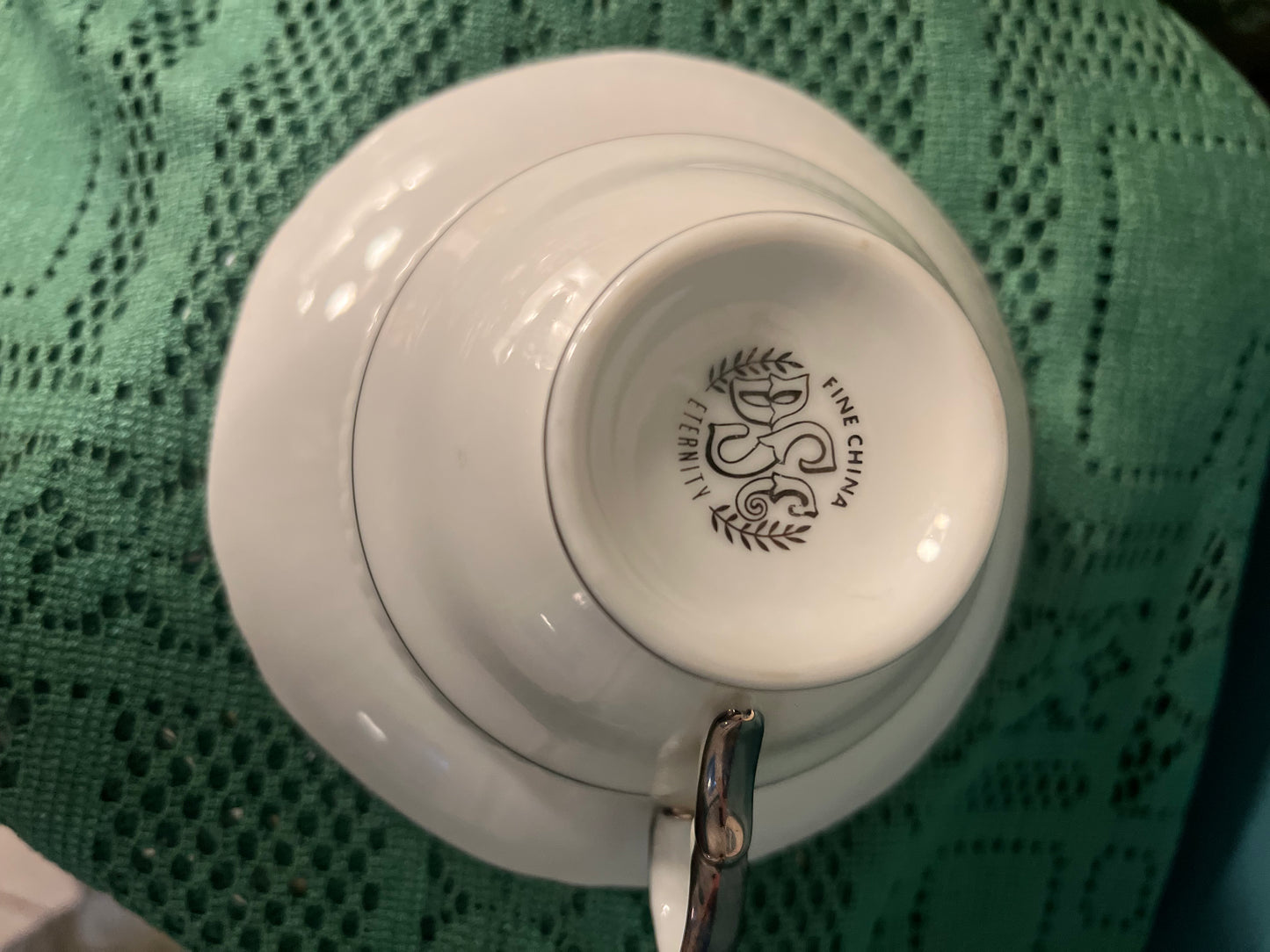 Footed cup and saucer set from Japan with ribbed embossed design