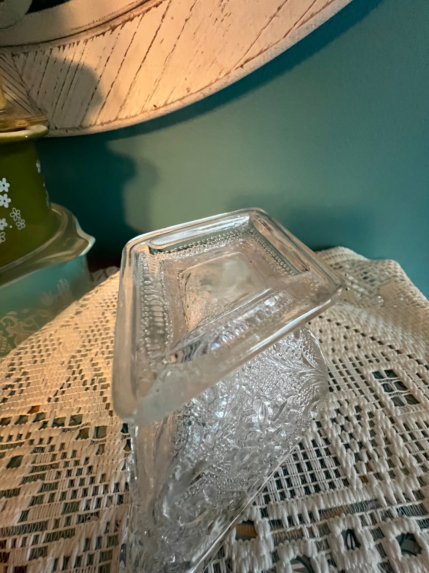 Vintage pressed glass creamer with beaded background