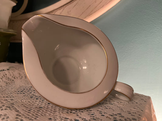 Mid-century Noritake bone china floral creamer with gold accents