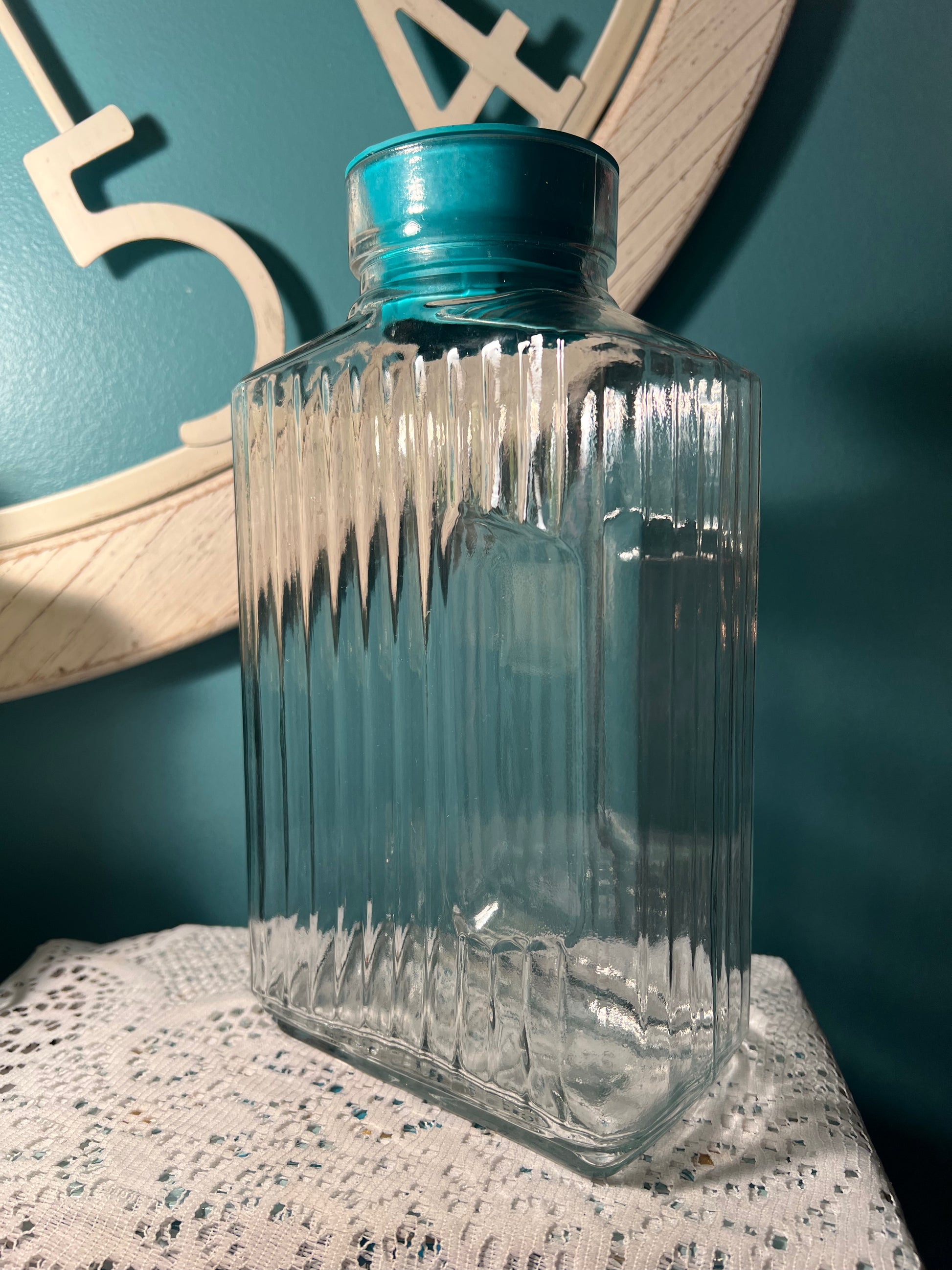 vintage Anchor Hocking Bistro juice pitcher with teal sleeve