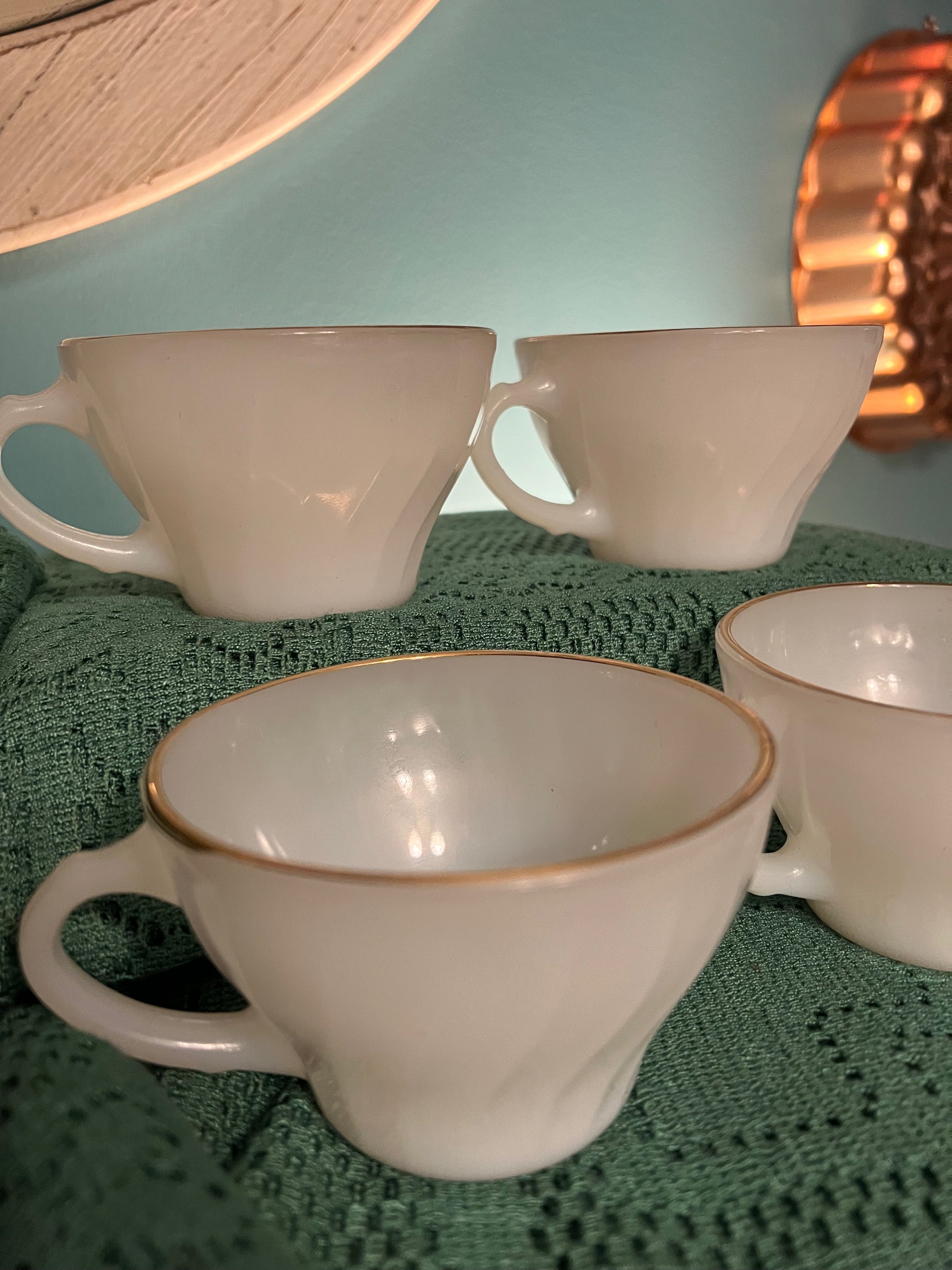 Elegant 1950s Anchor Hocking Swirl milk glass gold-rimmed teacup collectible