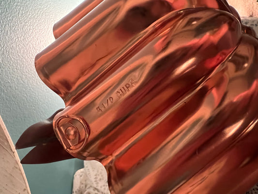 Midcentury copper jello mold with fluted design and built-in hanging loop