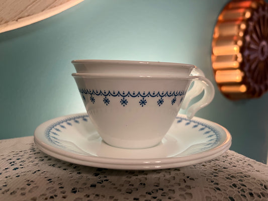 Vintage Corelle Snowflake Blue cup and saucer set with hook handle
