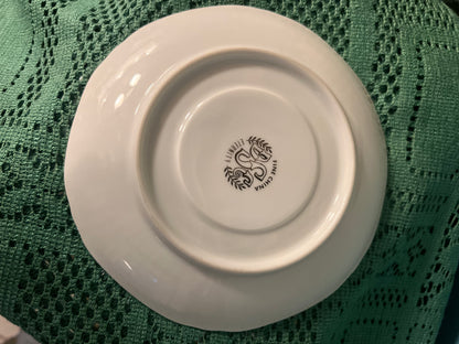 White china tea cup with embossed edge and platinum detail