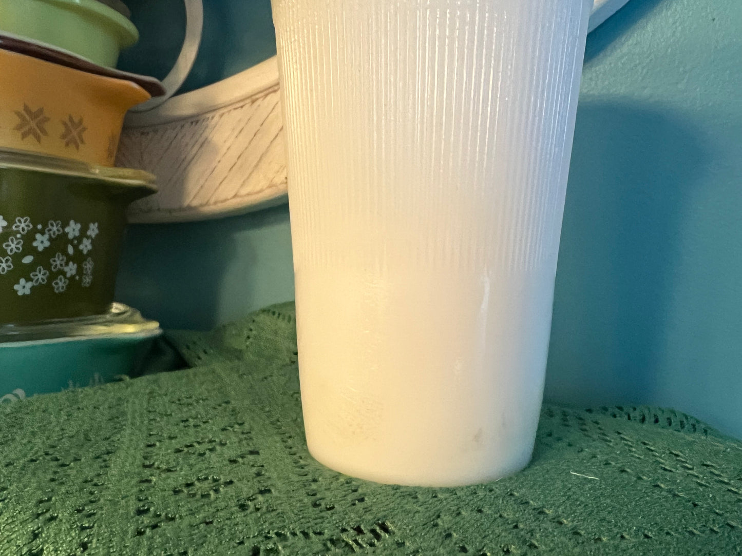 American milk glass vase with ribbed design and ruffled rim