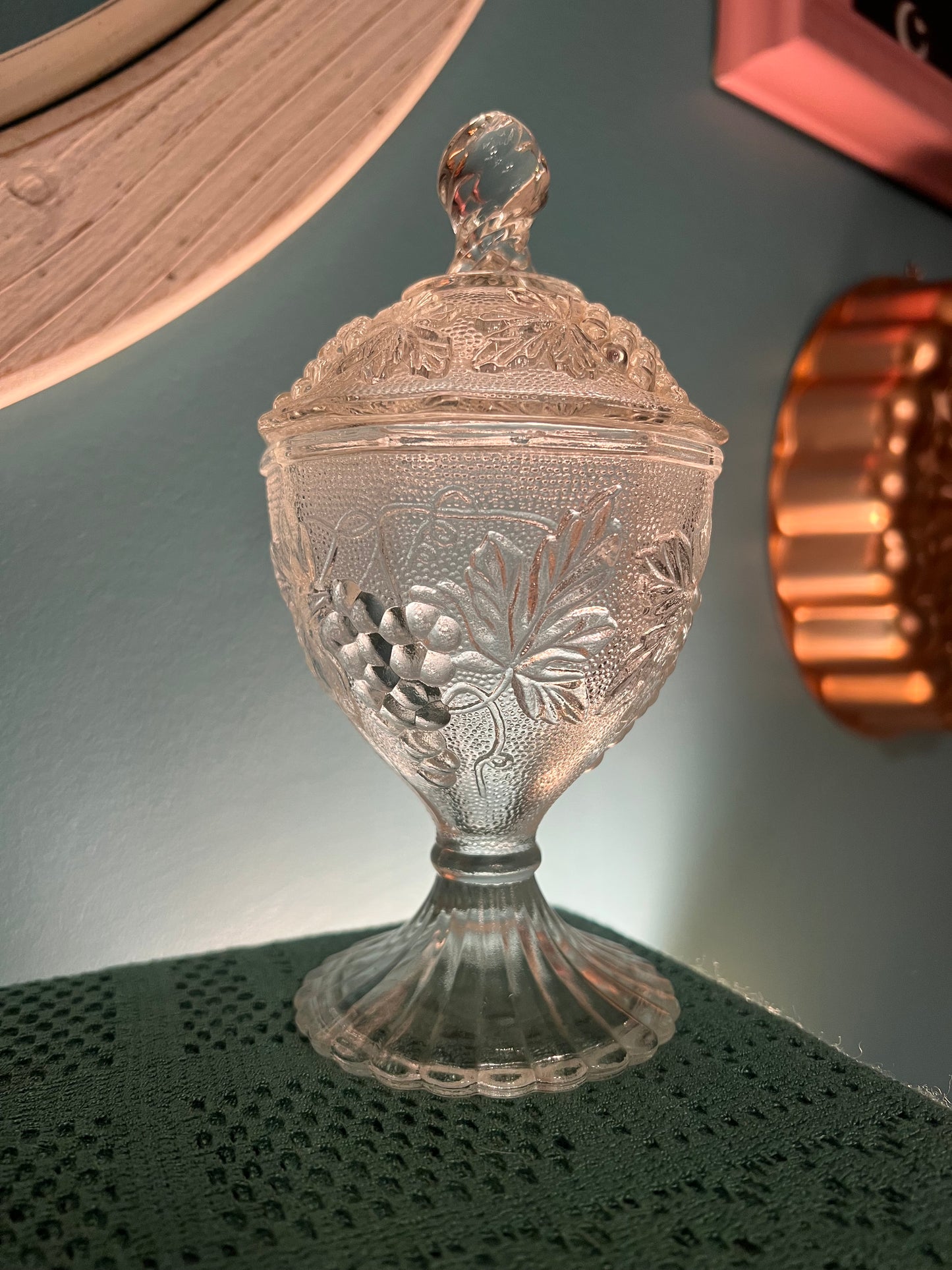 Early American Pattern Glass pedestal compote with grape and leaf design
