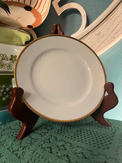 Gold-accented Noritake “M” cup, saucer, and small plate set for coffee, tea, or display