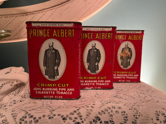 Antique Prince Albert Crimp Cut tobacco tin with red graphics from early 1900s