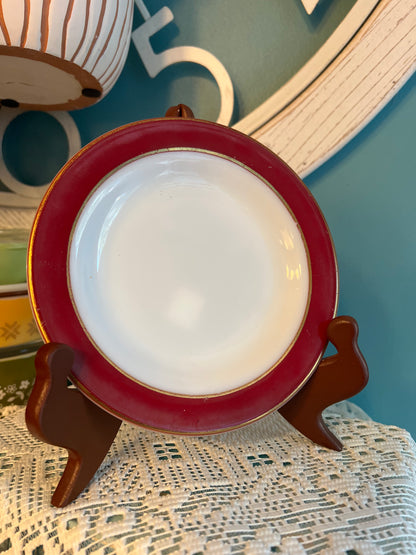 Vintage Pyrex Flamingo Red salad plate with gold trim