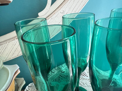 Dark green vintage Libbey champagne flutes with thin stem